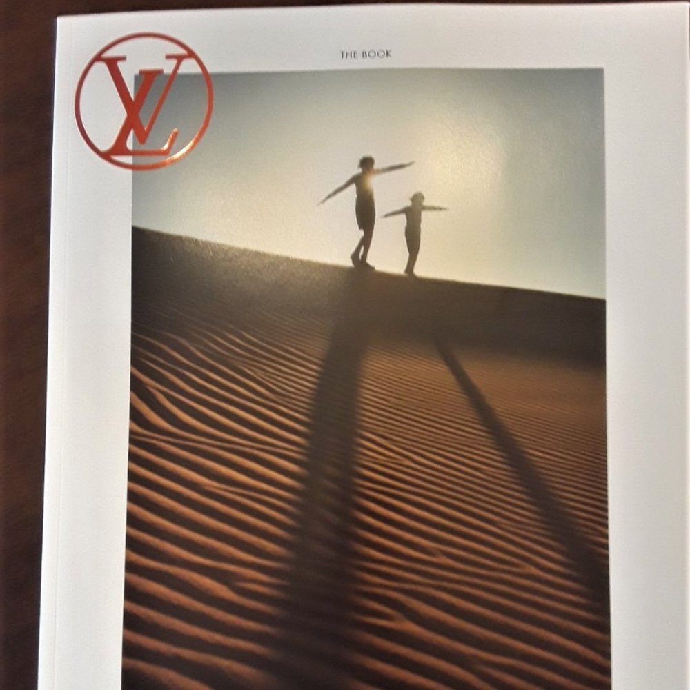 Newest Louis Vuitton 104 page catalogue of clothing, handbags tops pants scarfs